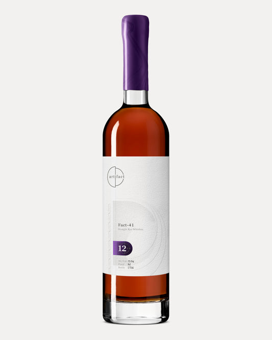Rye whiskey bottle with purple wax and white label.